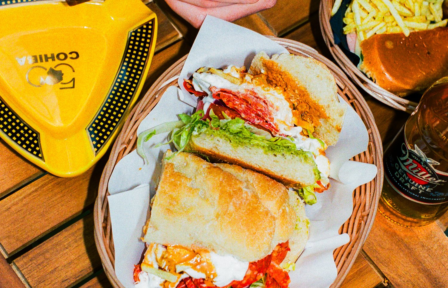 Melted cheese sandwich held up outside Alfonso's storefront