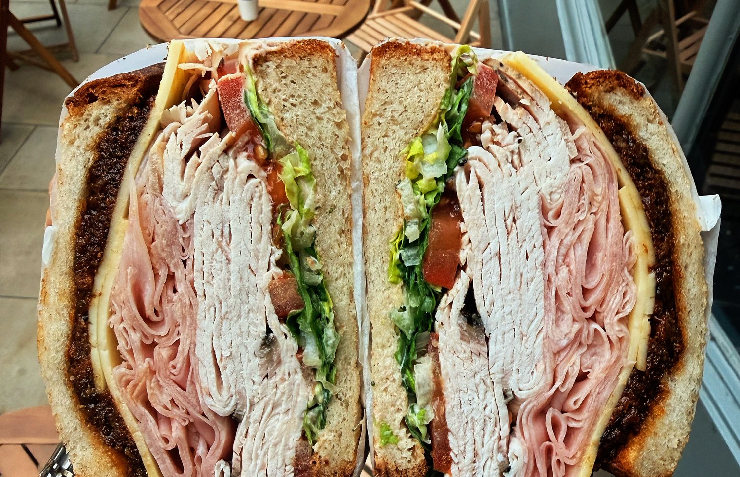 Sliced pastrami reuben-style sandwich stack